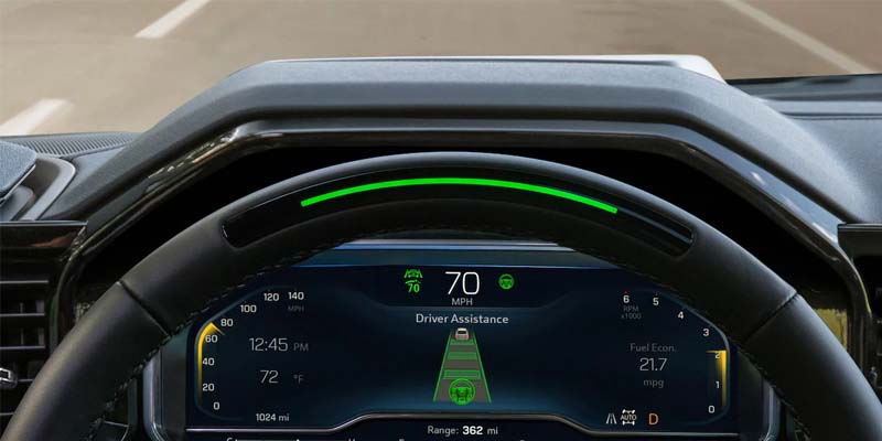 The steering wheel of a Chevrolet Silverado 1500, with the speedometer visible in the background.