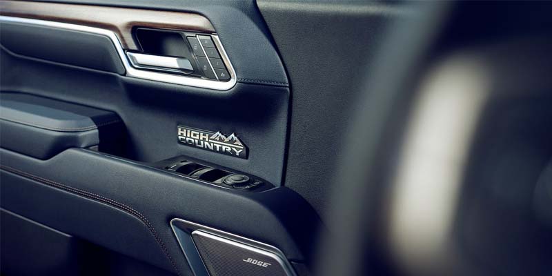The door handle and window controls on the interior of a Chevrolet Silverado 1500.
