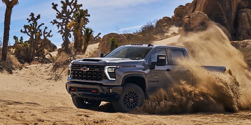 Chevrolet Silverado 2500 HD running in an off-road desert scene.