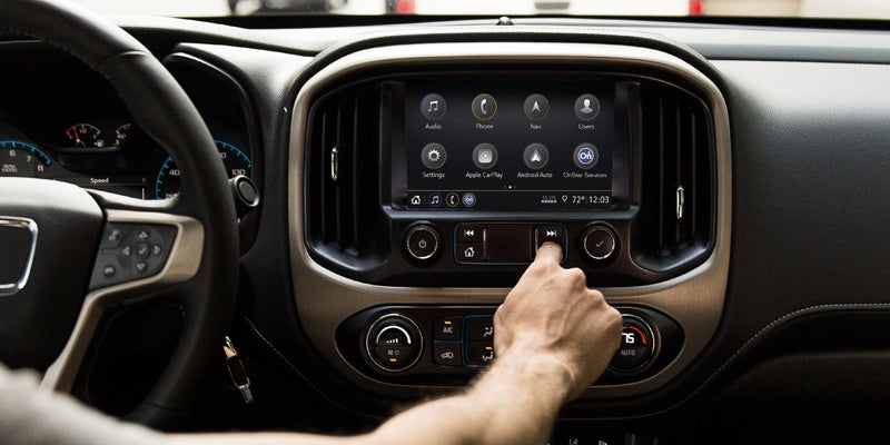 The infotainment system and dashboard of a GMC Canyon, showcasing the display and controls.