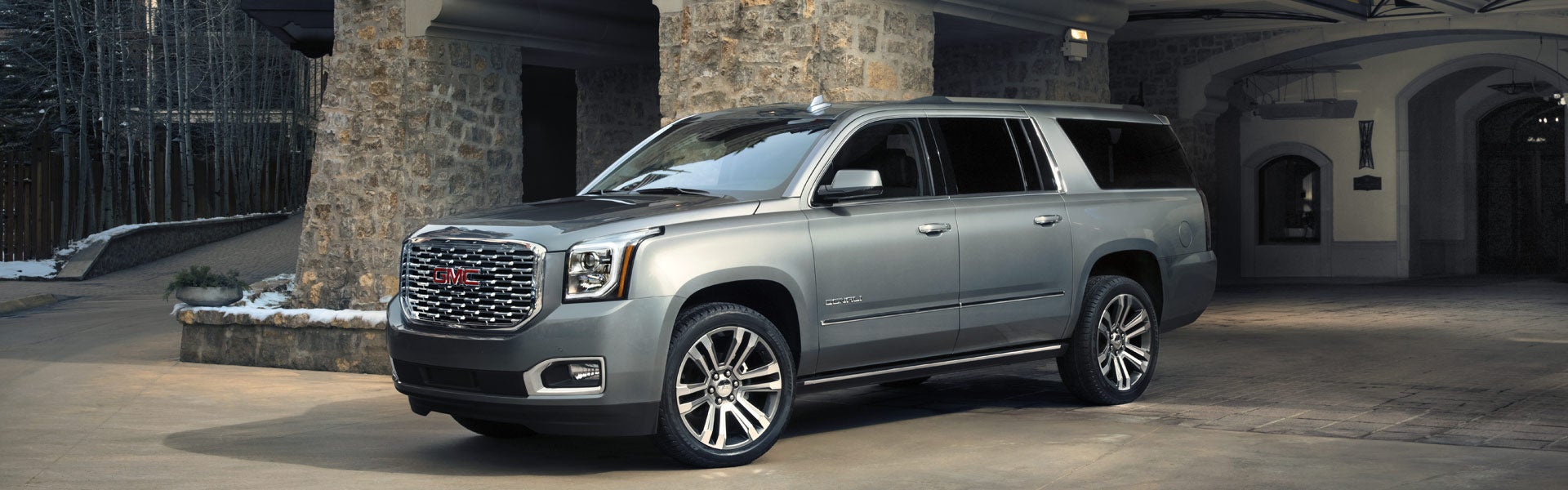 side view of a 2019 GMC Yukon, showcasing its sleek design and profile.