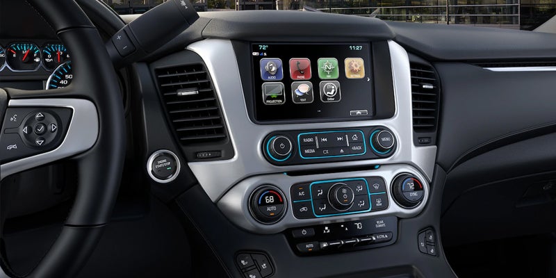 The display screen in a 2019 GMC Yukon, showing the dashboard controls and infotainment system.