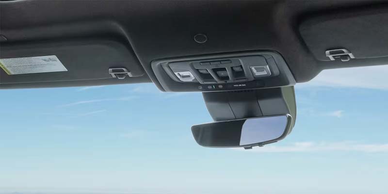 A rearview mirror in a GMC Sierra 1500.
