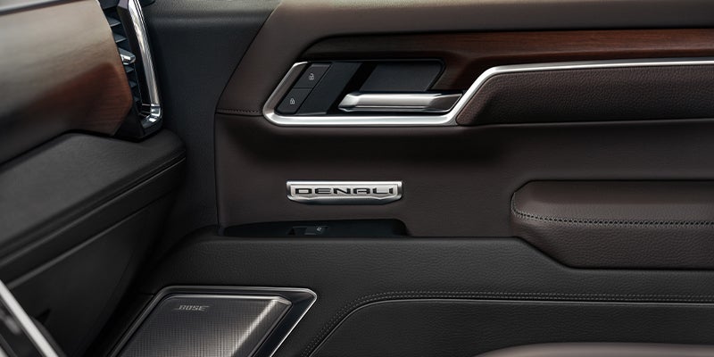 speaker and door handle of a GMC Sierra 1500, integrated into the interior for easy access and premium sound.