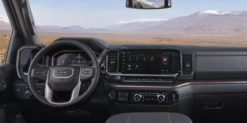 The Stylish Interior of the GMC Sierra HD with Steering Wheel and Infotainment System