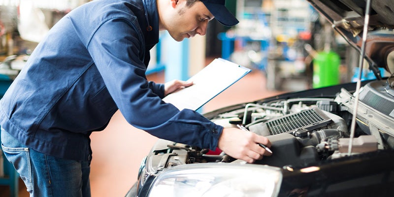 Parker Chevrolet GMC in Ashburn GA technician working on an engine
